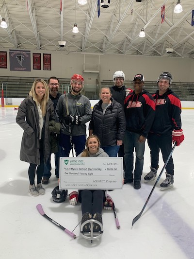 Sled hockey team presented with donation from Wayne State Physical Therapy