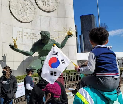 #StopAsianHate supporters rally in from of the Spirit of Detroit.