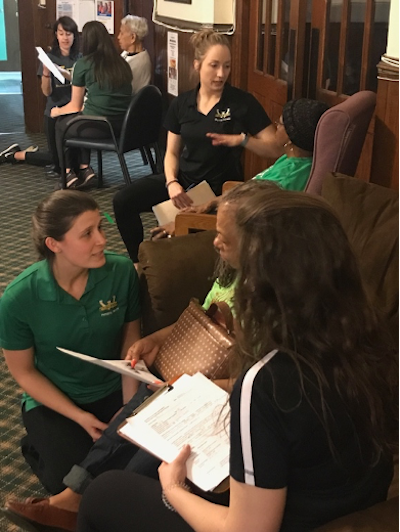 Students interview seniors during Balance and Fall Screenings at St. Patrick's Senior Center in Detroit.
