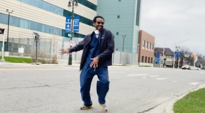 Dr. Dennis Parker dances on campus