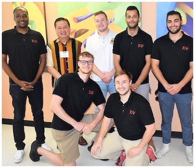 World Medical Relief CEO Dr. George Samson with Kappa Psi brothers Johnie L. Bailey, Evan Johnson, Noah Trotter, Daniel Frederick, Fadi Manuel and Hussein Safaoui.