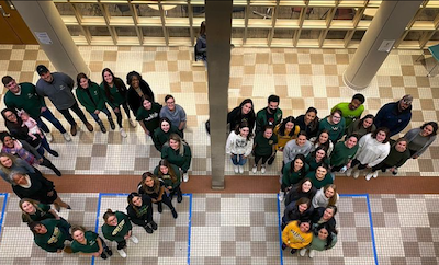 OT students, faculty and staff spell out OT