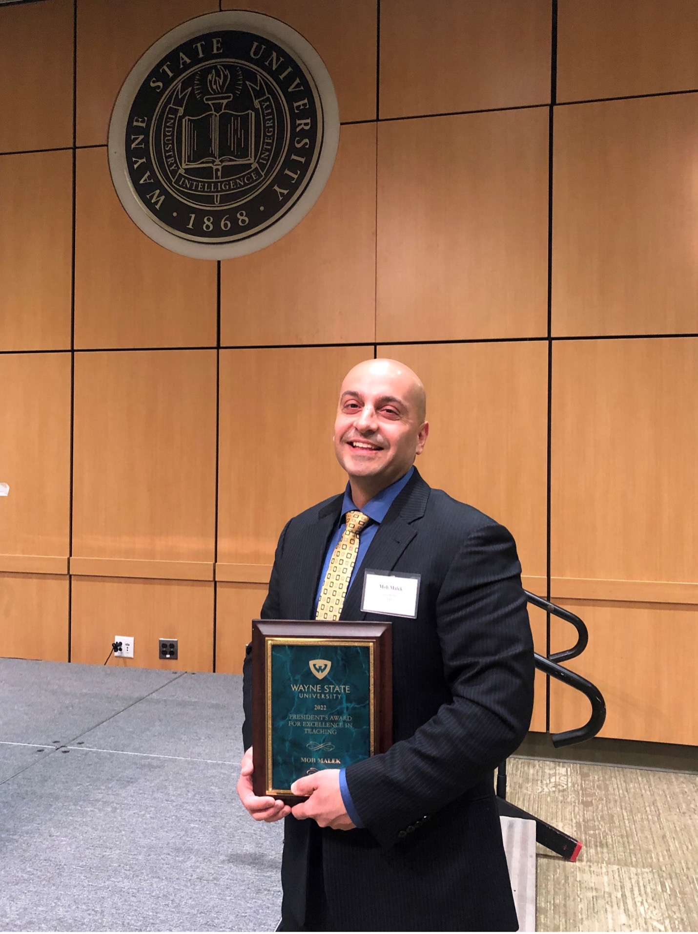Wayne State Prof. Moh Malek with his award plaque