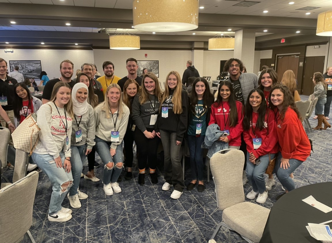 Student pharmacists from throughout Region 4 representing their programs with spirit wear. Go Warriors!