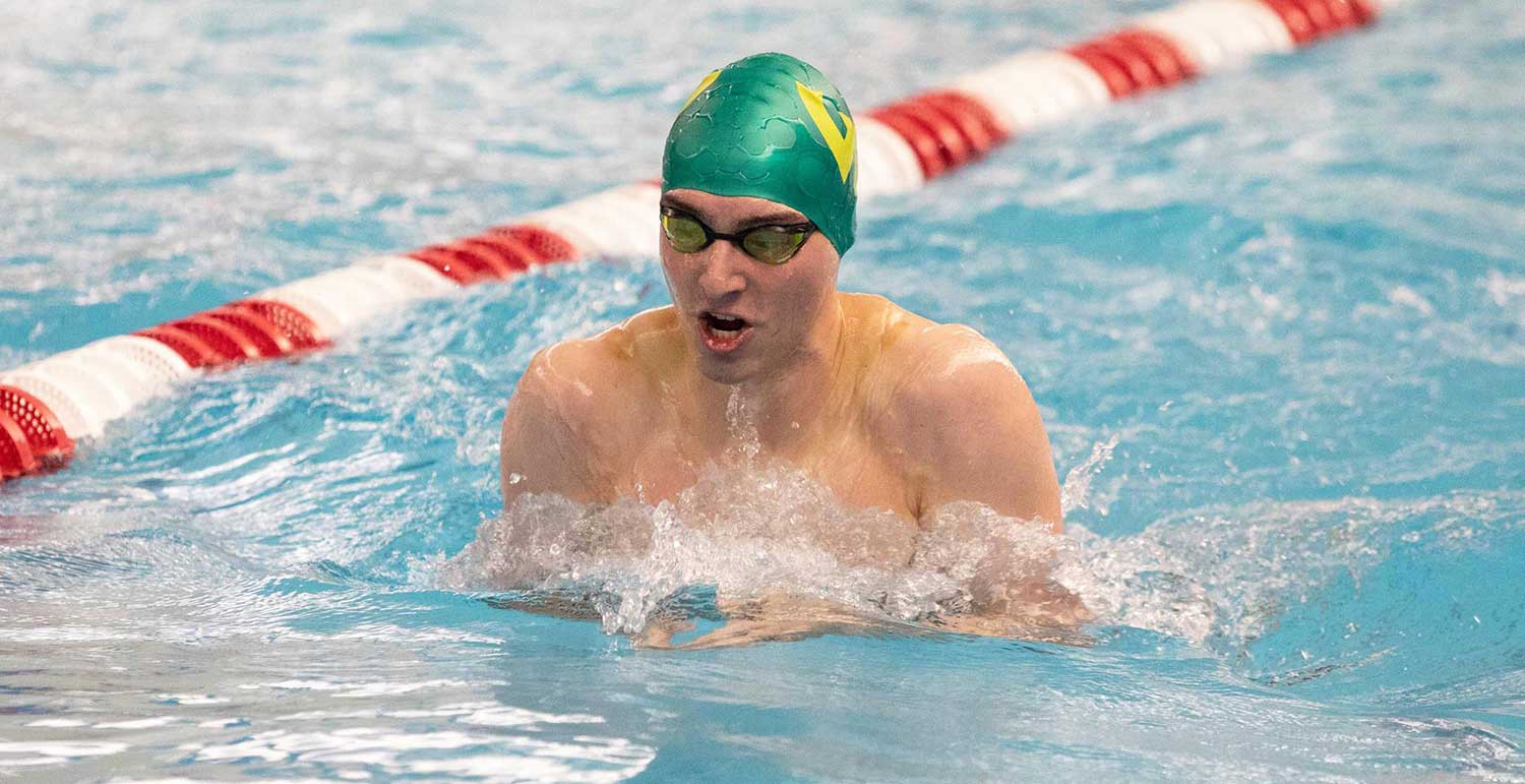 Chris Spencer swimming breaststroke in a pool