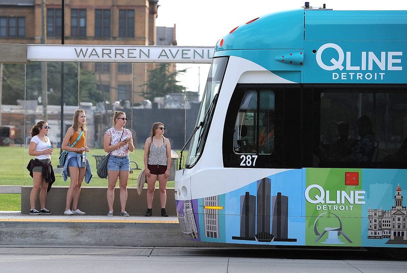 Students wait at the Warren Ave. QLine stop