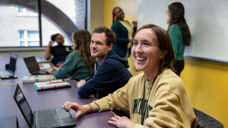 Wayne State students work on laptops in the undergraduate library.