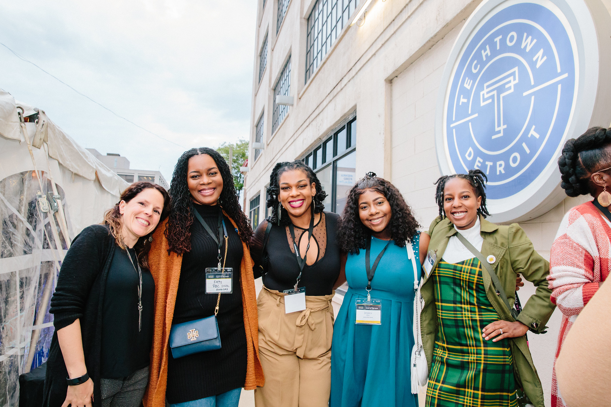  Christina Devlin (left), retail strategist at TechTown Detroit, gathers with program alumni and local small business owners at the 2022 Toast of the Town.
