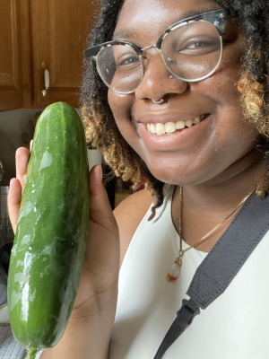 AeYanna Yett holding cucumber