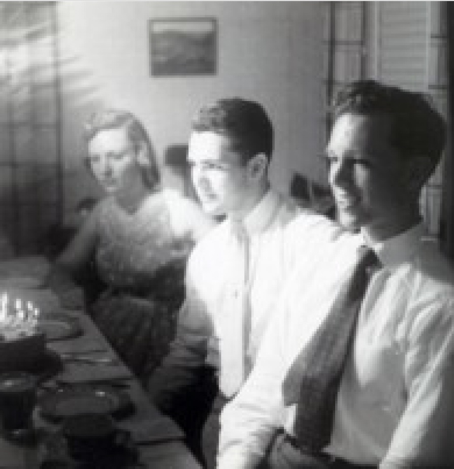 Black and white photo of three students in 1956.