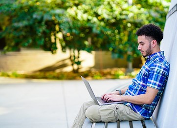 student studying at computer