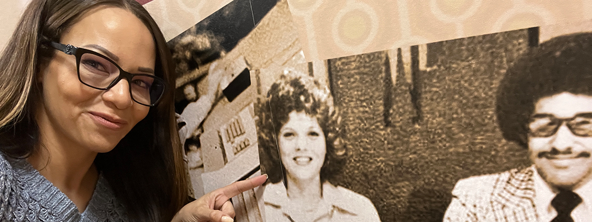 Amyre Makupson points to a photograph of her mother’s pictured on the wall at the WGPR Historical Society in Detroit.