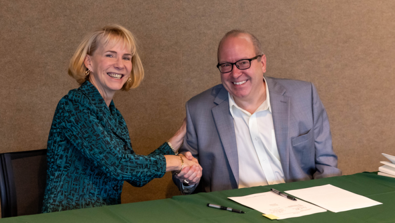 WSU President Dr. Kimberly Andrews Espy and Dr. David J. Gorsich, Chief Scientist at GVSC, moments after signing the education partnership agreement