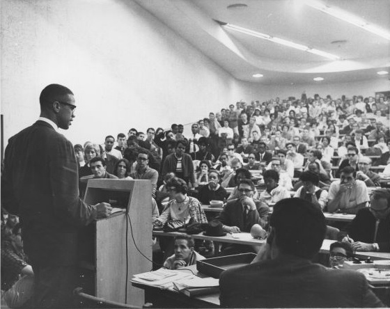 Malcom X speaks to students inside of State Hall.