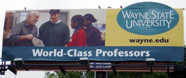 Dave Lowrie and students featured on a billboard.