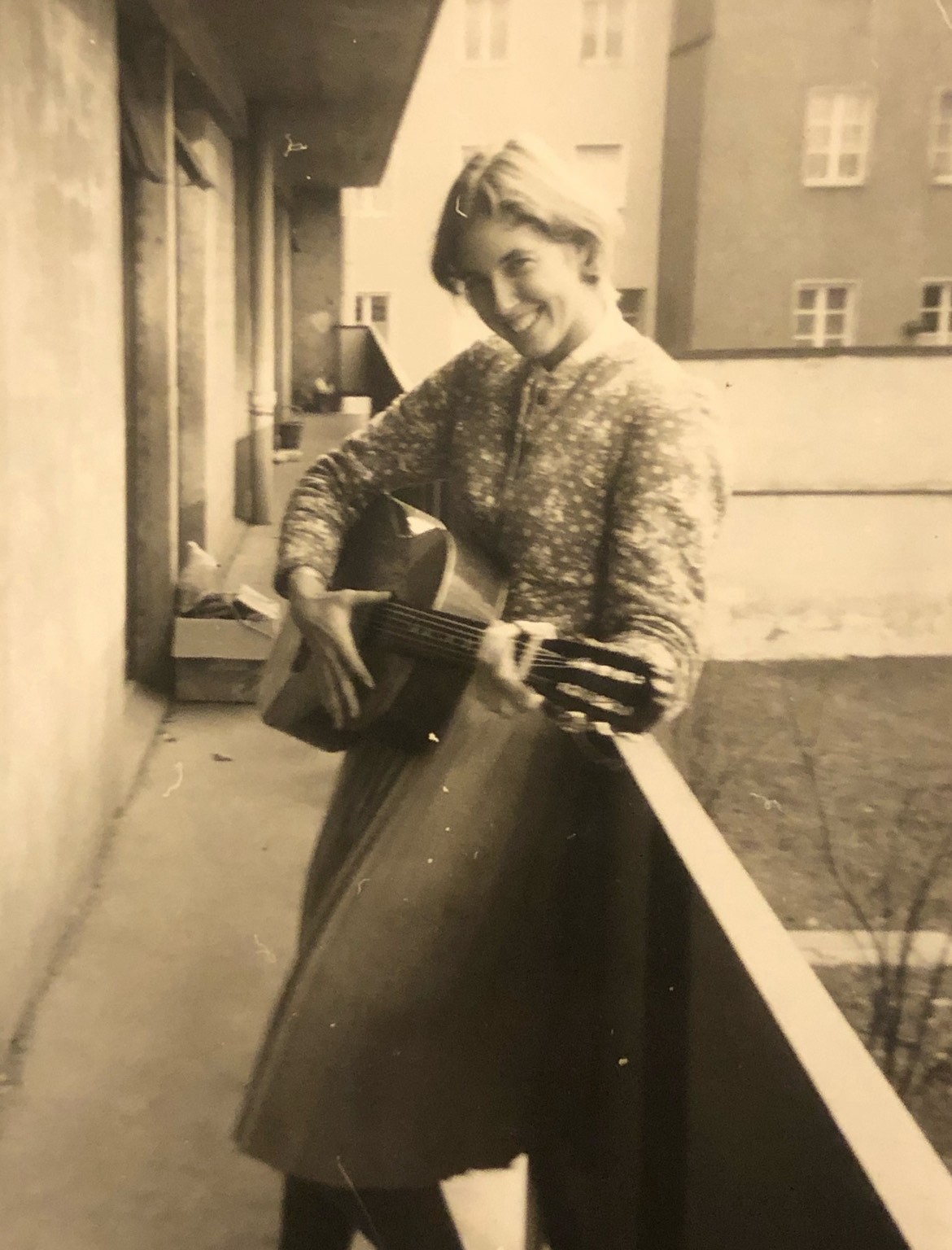 Bronwen (Jenney) Anders during her JYM year with a guitar purchased at a flea market