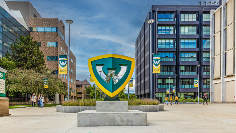 The Wayne State University shield statue on campus.