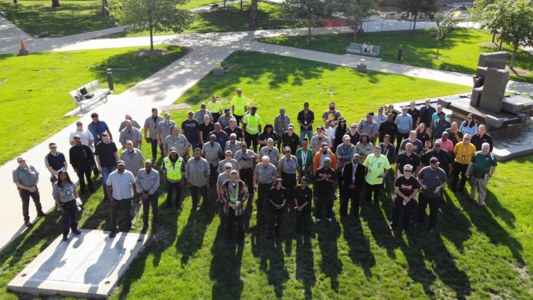 Wayne State’s Facilities, Planning and Management team pose for a group photo on Wayne State's campus.