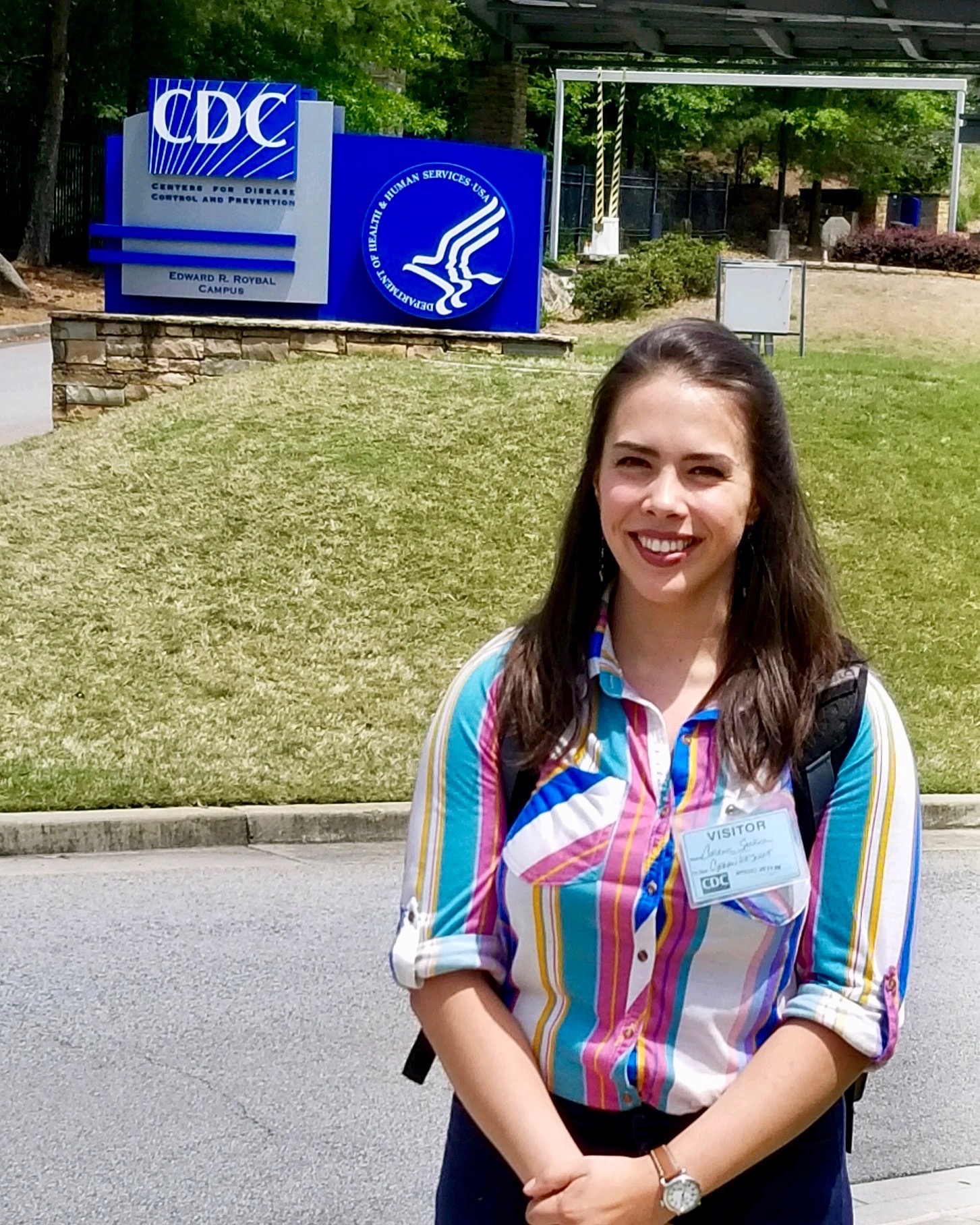 Sanger standing in front of a CDC sign