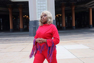 Daynah in an original work, arteries jumpsuit made for the American Heart Association's Go Red Campaign