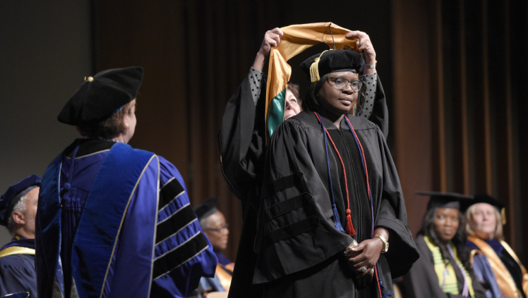 A graduate earns a doctor of nursing degree.