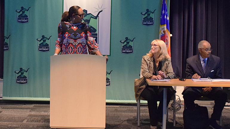 Flinn Foundation CEO Andrea Cole looks at WSU School of Social Work Dean and CBHJ Director Sheryl Kubiak while moderating a panel discussion