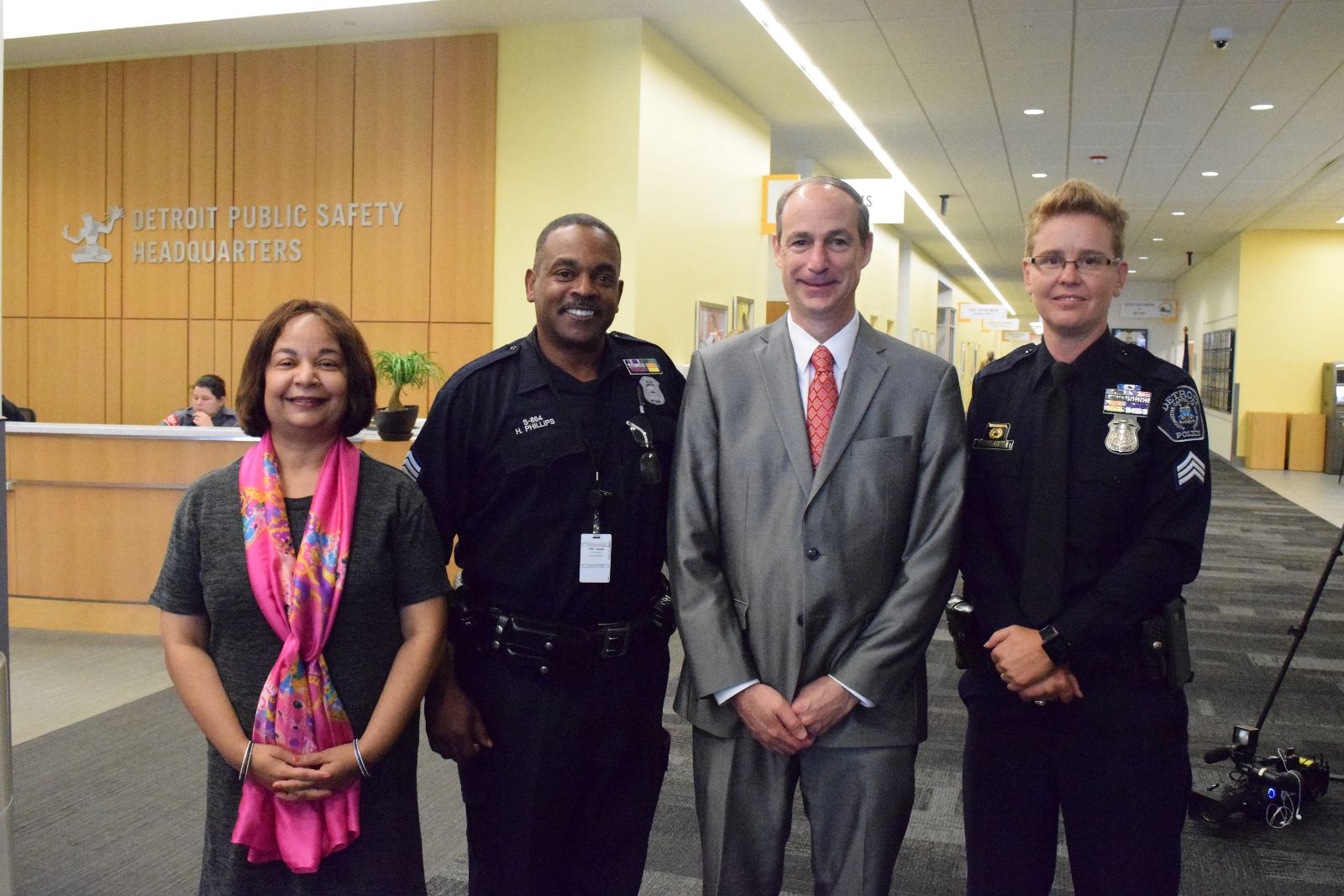 Associate Provost and Dean of Wayne State's Graduate School, Ambika Mathur, DPD Sergeant Howard Phillips, College of Liberal Arts and Sciences Dean Wayne M. Raskind, DPD Sergeant Dawn Engel.