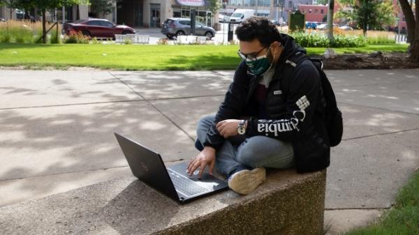 Man studying on campus