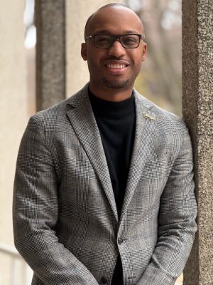 Photo of Eric Reed in front of the College of Education