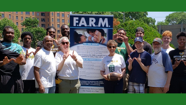 FARM volunteers include WSU football players, staff and other undergrads. FARM founder and CEO Willie Bell and WSU professor Carolyn Dayton in white shirts front row, left.