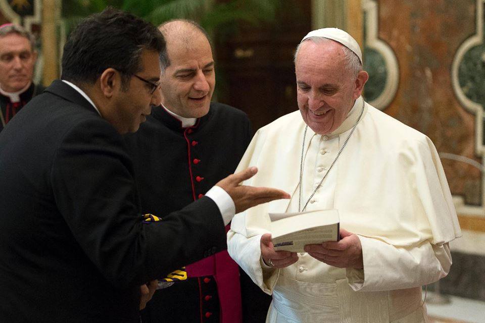 Saeed Khan speaks with the Pope.