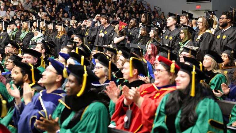 Graduates celebrate.