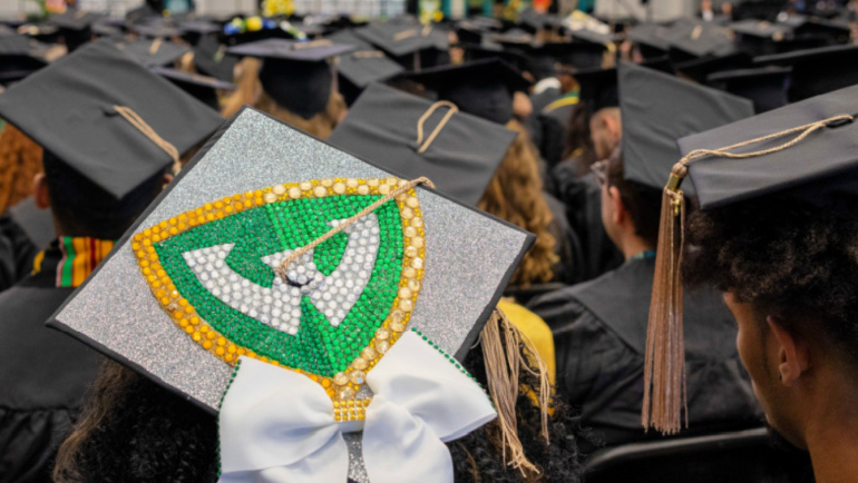 A sea of graduation caps, adorned with Wayne State pride