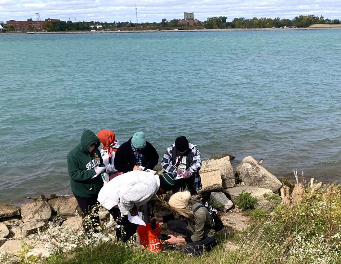 Students collecting samples at the Huron River