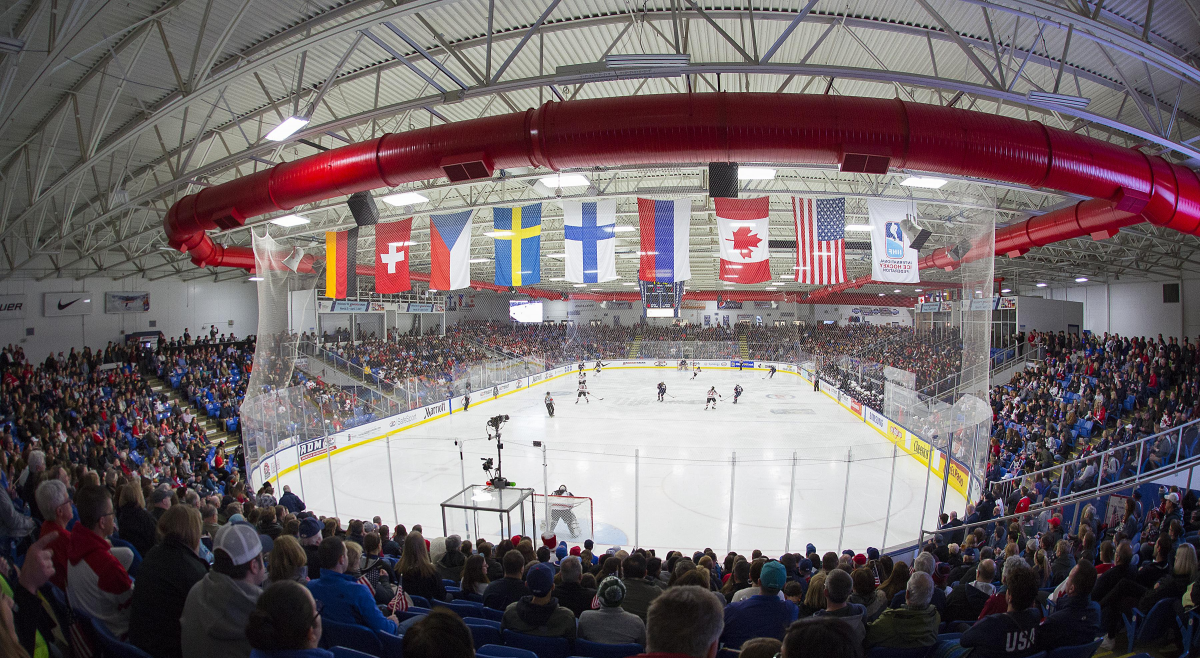 USA Hockey rink with country's flags in front