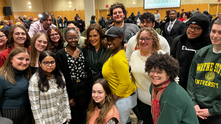Michigan Governor Gretchen Whitmer is surrounded by area high school students, who can take advantage of the Wayne State Guarantee.