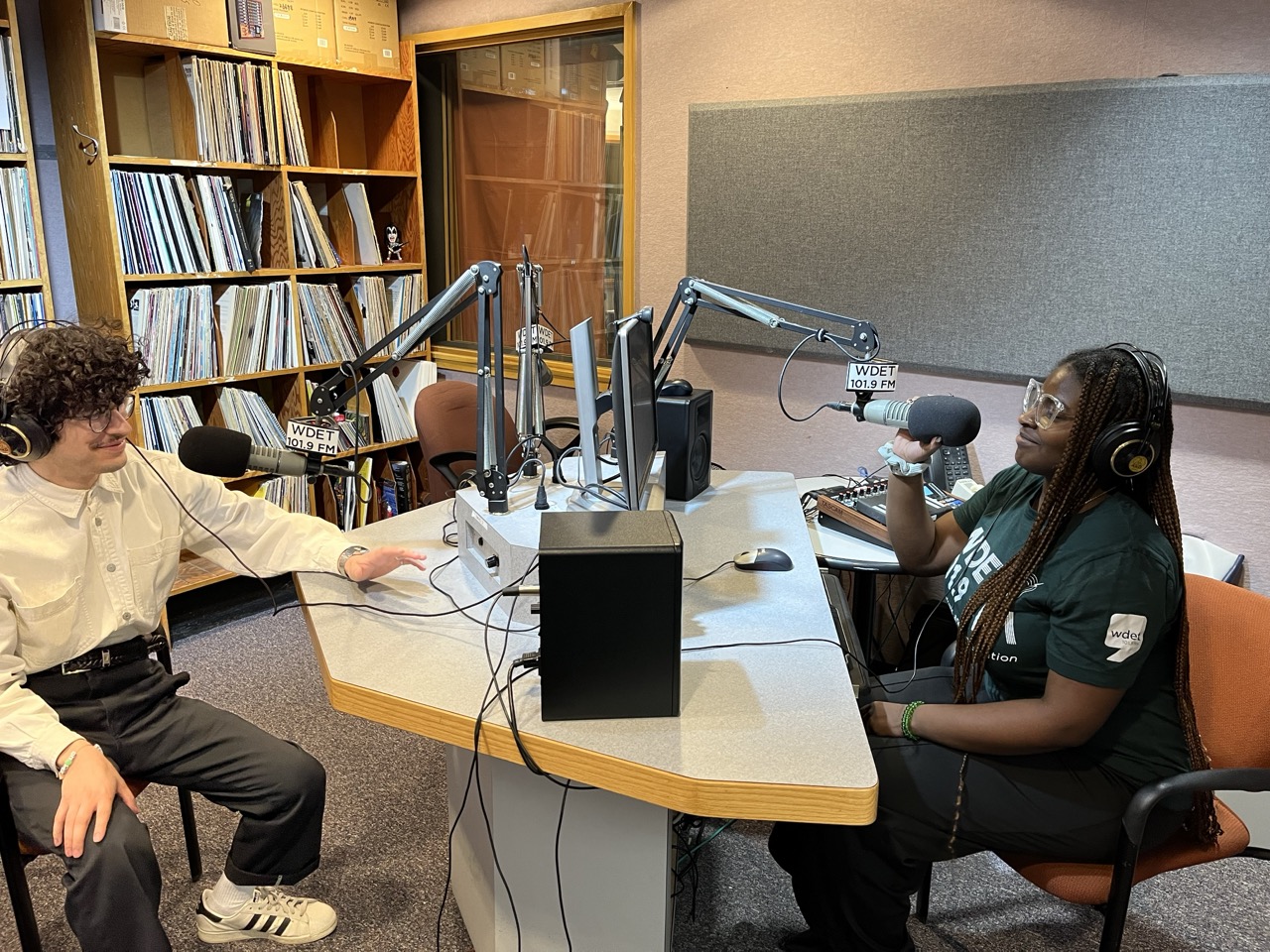 two WDET interns sit in the radio booth