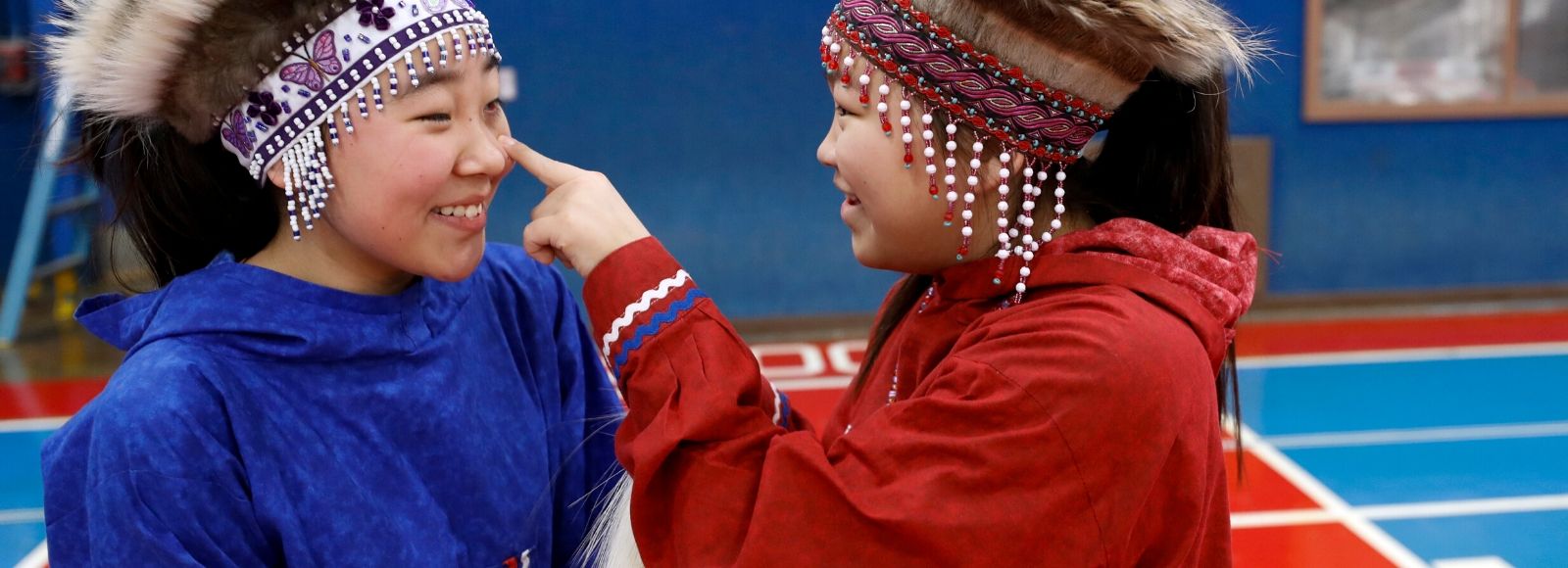 Alaska Native girls prepare to dance in honor of the beginning of the 2020 Census in rural Alaska. The Census count begins in this state out of necessity and tradition