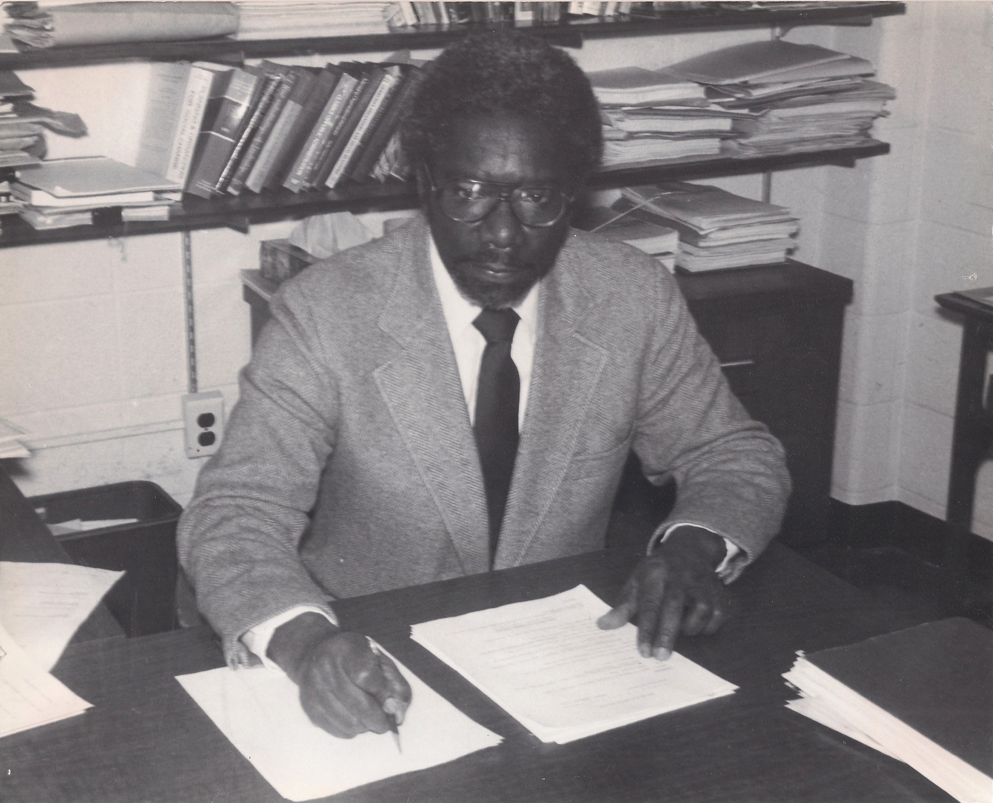 William Iverson Jr sitting at a desk in the WSU School of Social Work
