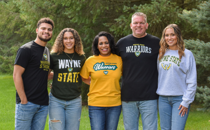 The Jackson family, from left to right: Isaac Jr., Aubrey, Ericka, Ike and Darian, poses in Wayne State gear.