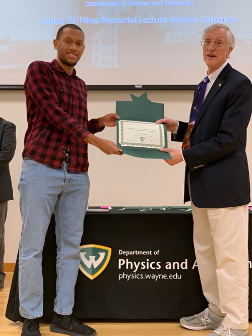 Dr. John Mather (right) awards a scholarship to undergraduate Physics major Jamar Philip (left) at the Vaden Miles Memorial Lecture on March 28, 2024.