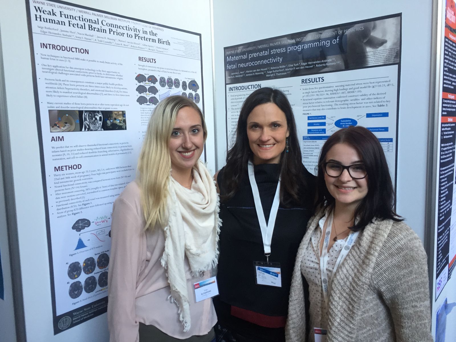 Jasmine Hect (right) presents her research alongside SCANlab researchers