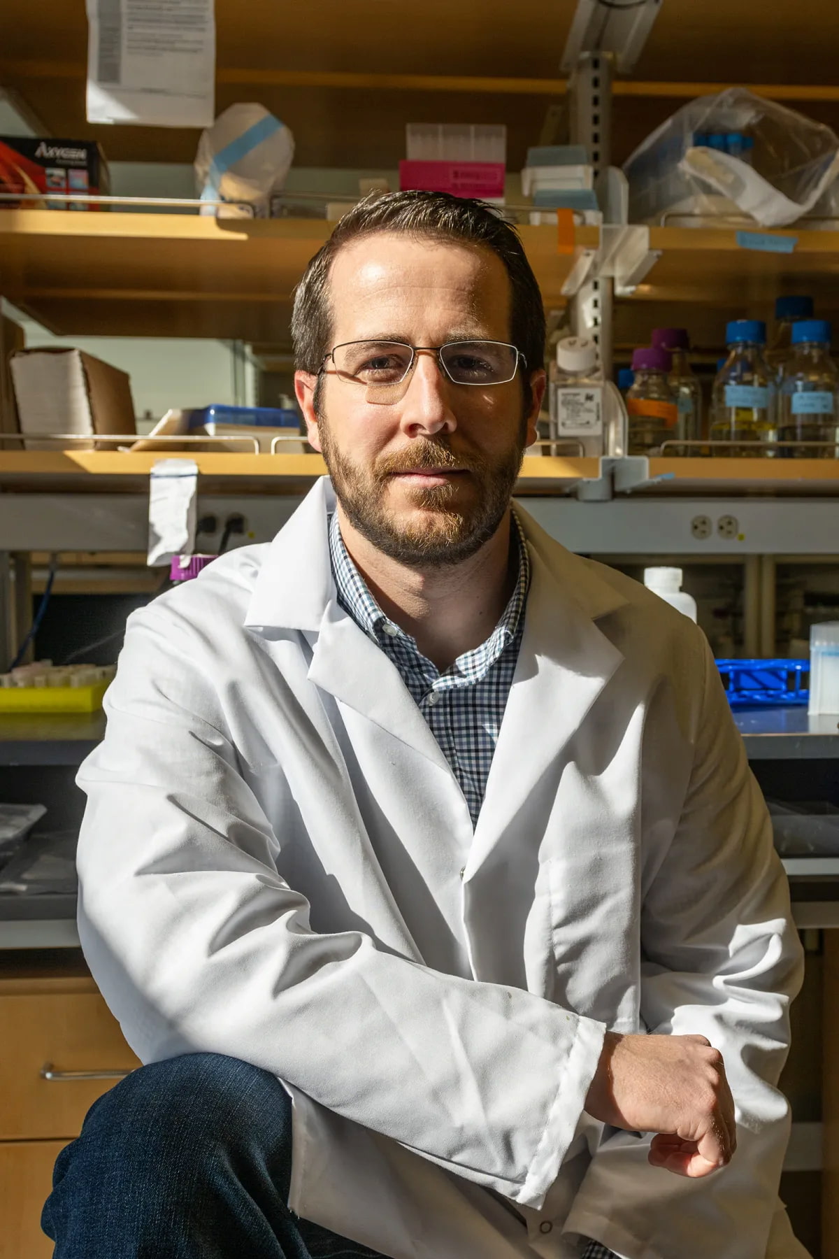 Jason McLellan in a lab coat