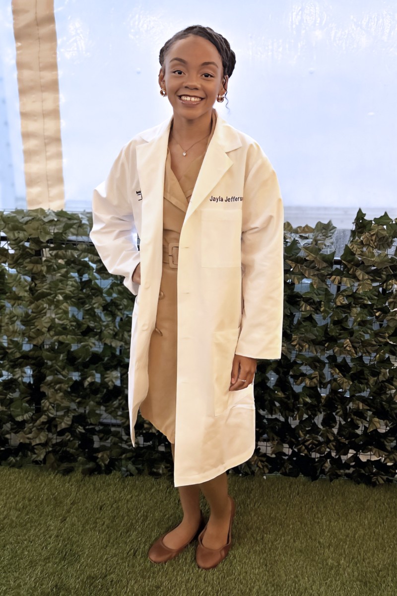 Wayne State Public Health Student Jayla Jefferson poses in a white lab coat