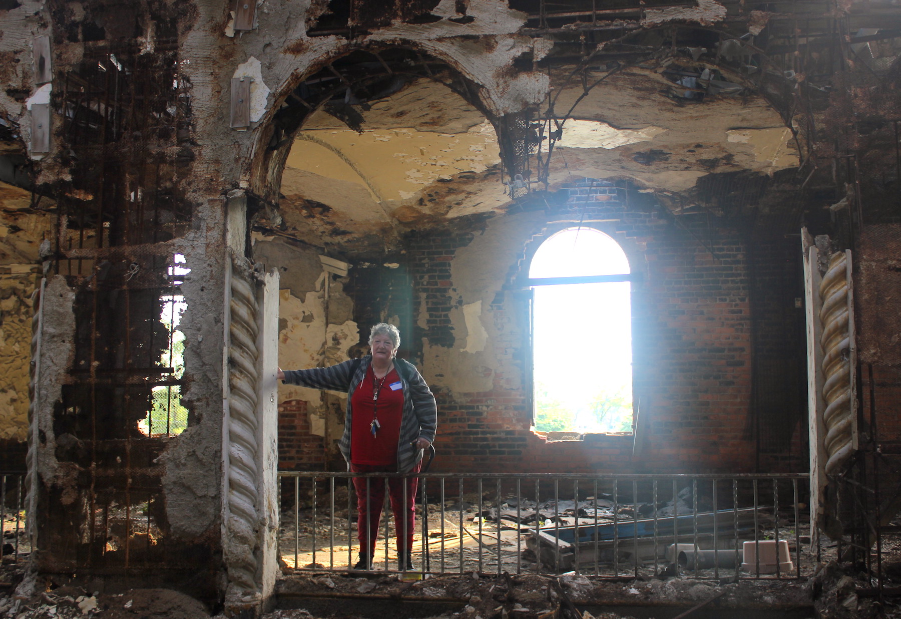 Jeri standing in an old building