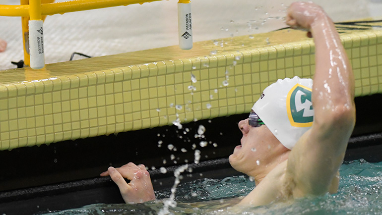 WSU swimmer Trevor Jones reacts in the pool to his finish time following a recent race. 