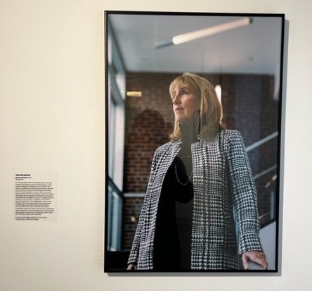 A portrait of Sheryl Kubiak hangs in the Free Your Mind art exhibit at the MOCAD