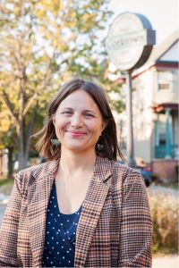 Photo of Sarah Lenhoff with a Corktown sign in the background