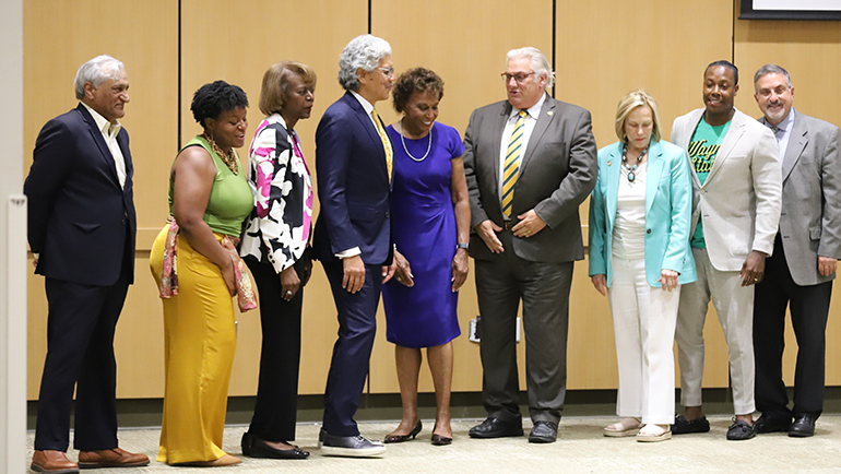Following Thursday's award presentation, Denise Lewis posed for pictures with President M. Roy Wilson and members of the Wayne State Board of Governors.