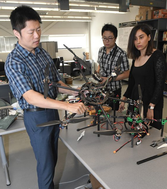 Yanchao Liu and students performing drone research.